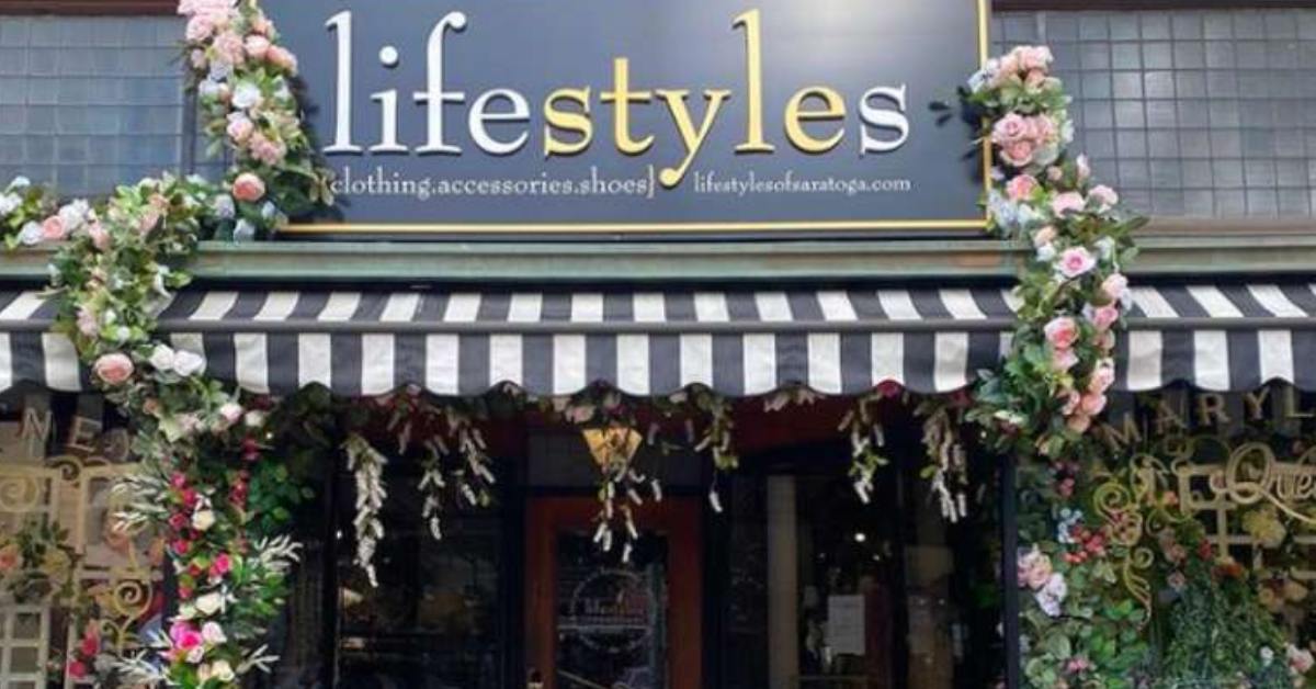 lifestyles sign with flowers around it on the awning