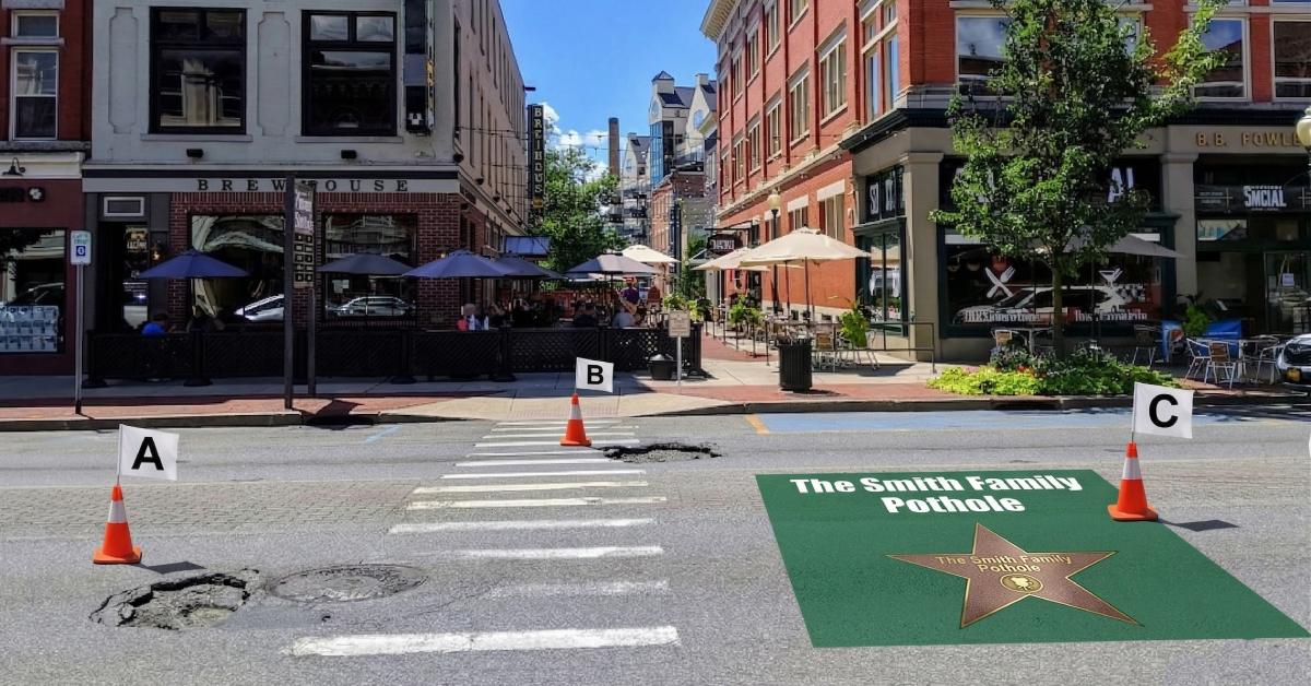 city street with potholes, cones, and a green hall of fame star section