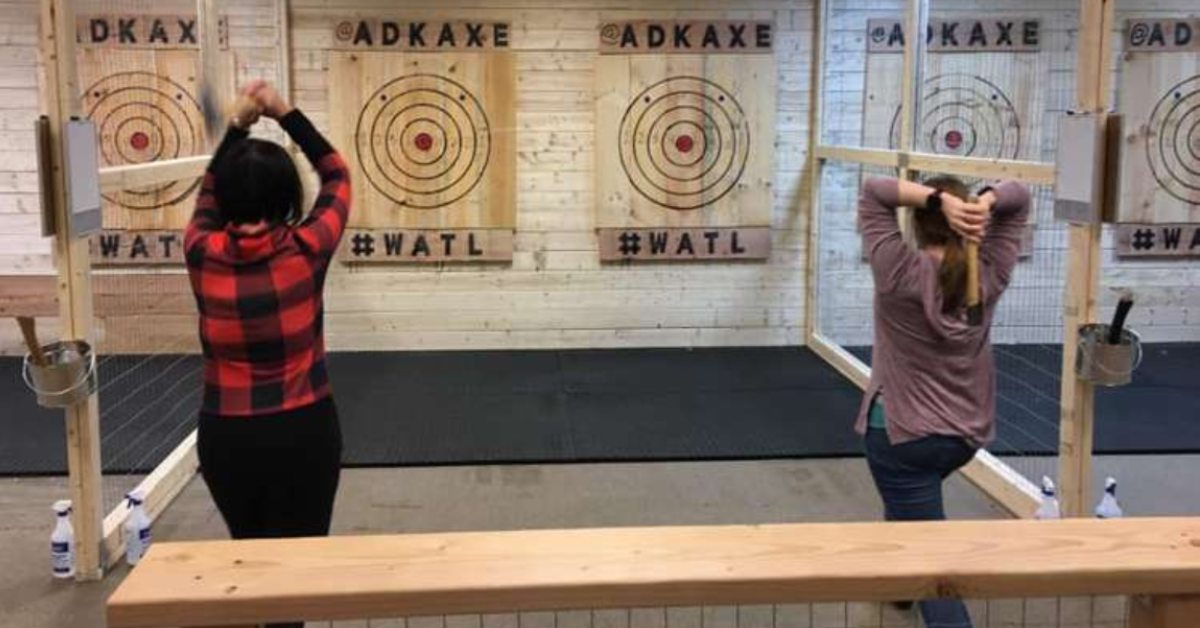 people axe throwing side by side
