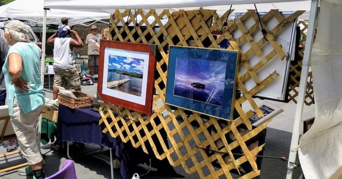 colorful picture hung up on a piece of fencing