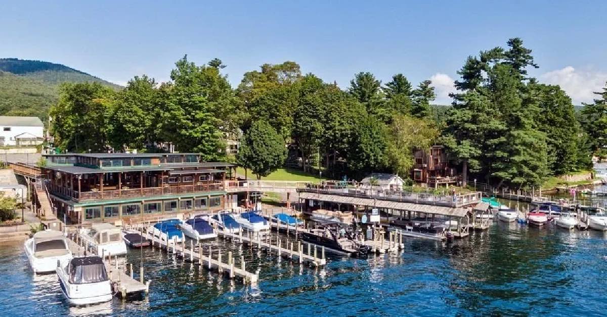 Boardwalk Restaurant & Marina in Lake George with docks, boats, and waterfront dining area