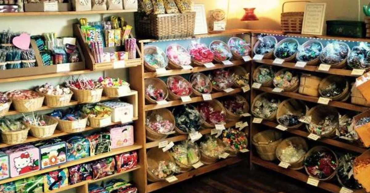 variety of candy in baskets on shelfs