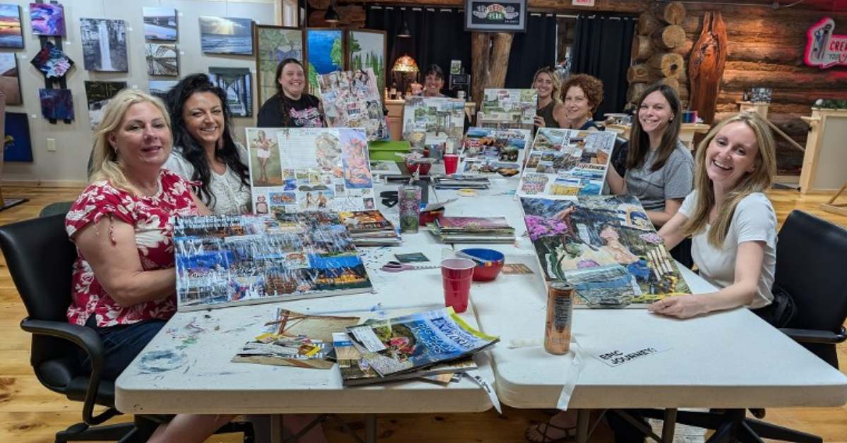people gathered around table at creative jam with art pieces