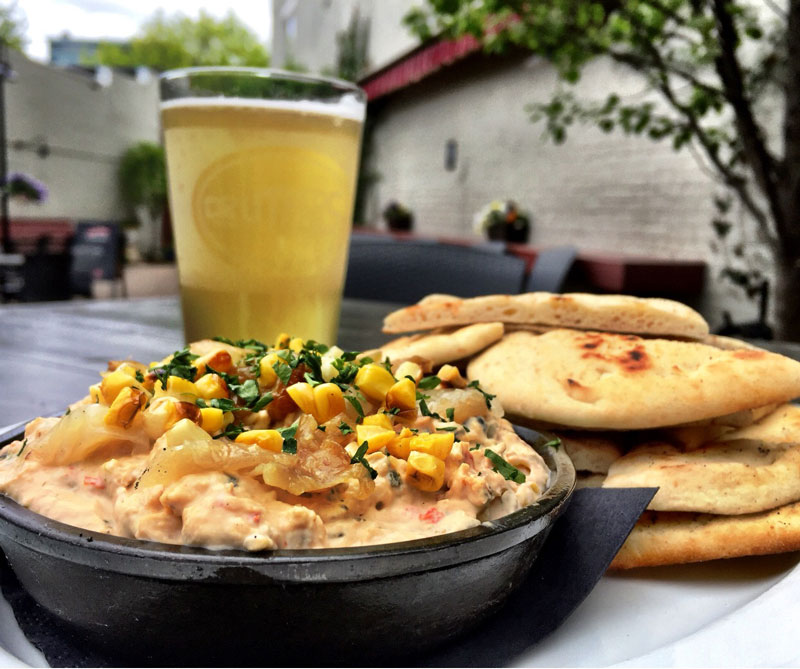 a beer and food on the patio at druthers