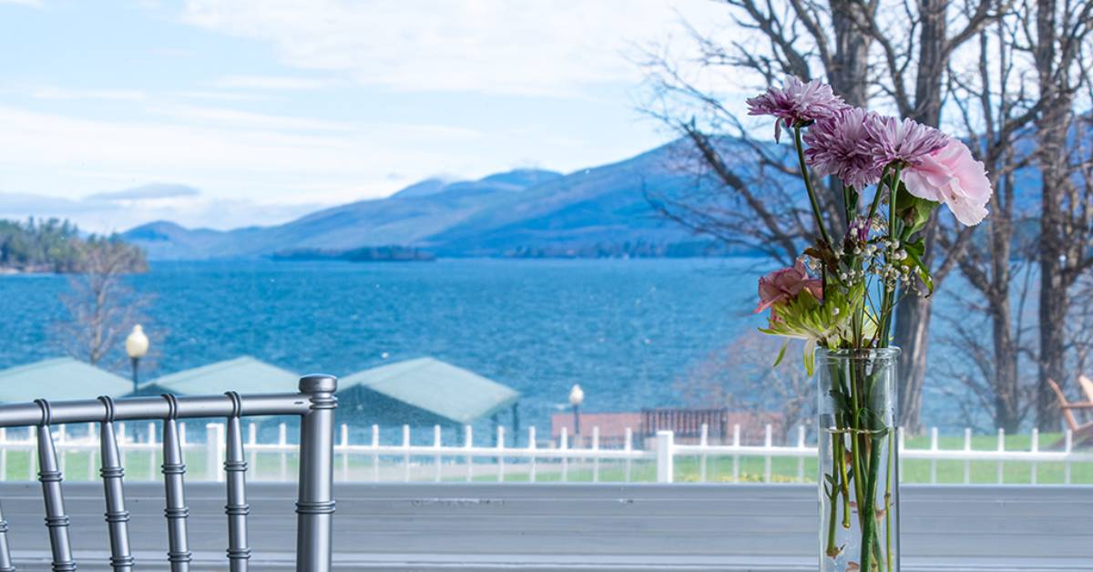 view of lake george from restaurant window with flowers