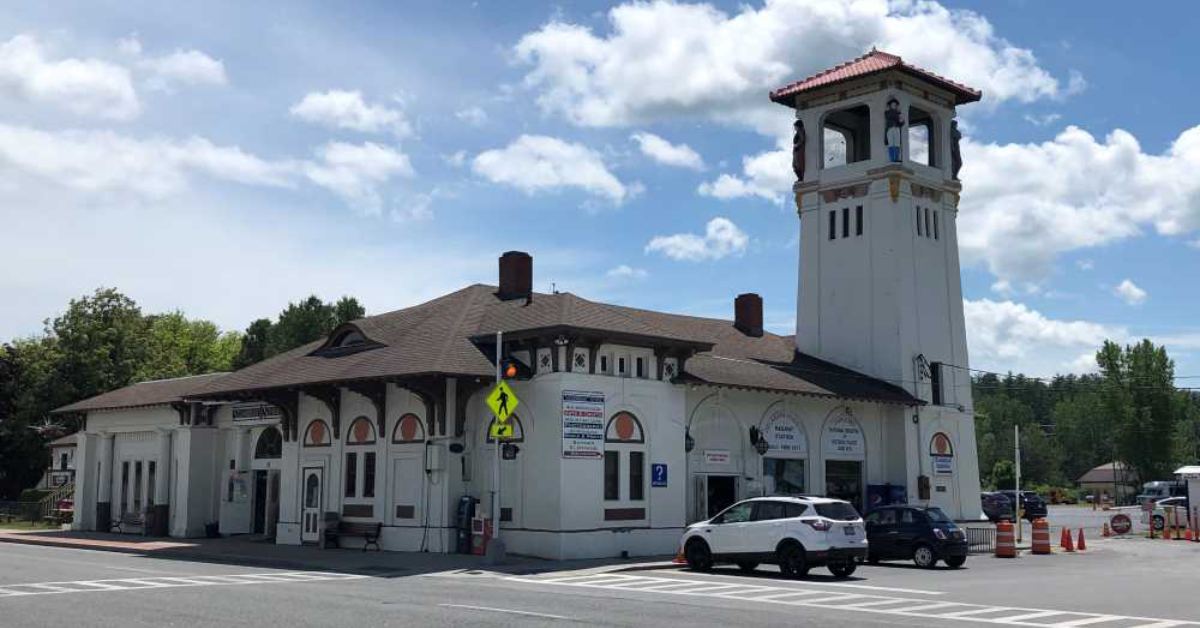 Historic building and shops along Beach Road in Lake George with tower and village streetscape