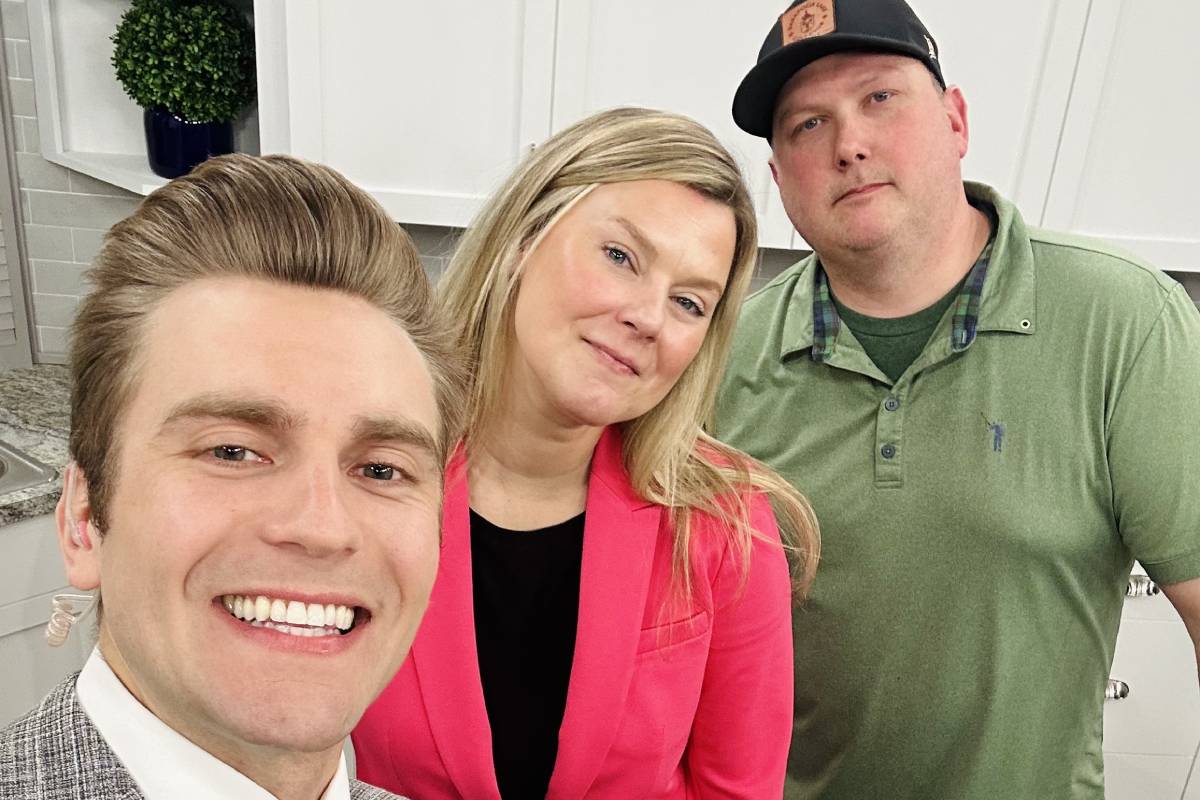 three people pose together