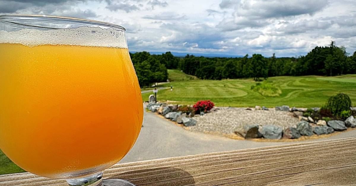 beer on deck overlooking golf course