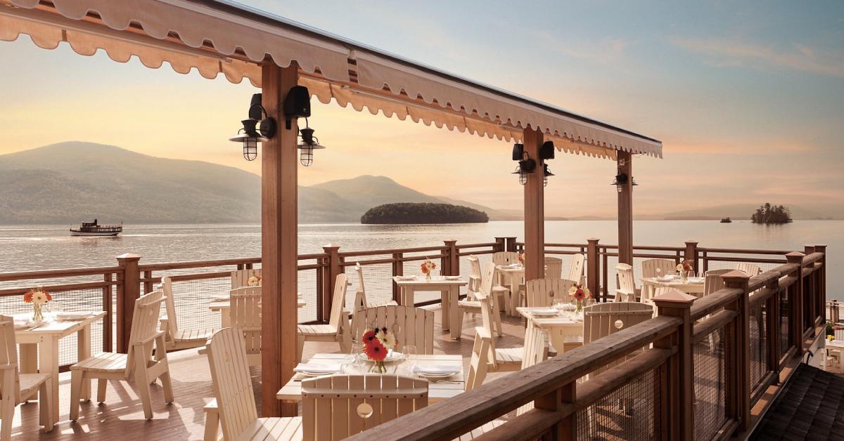 outdoor dining on a pavilion overlooking a lake
