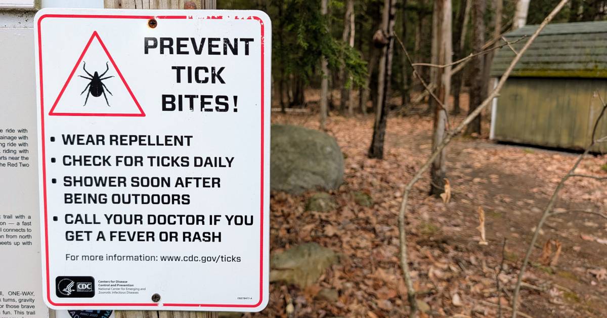 prevent tick bites in front of hiking trail