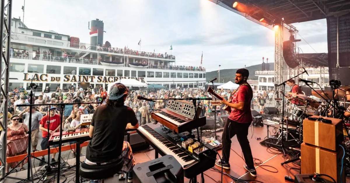 musicians play on stage at rock the dock