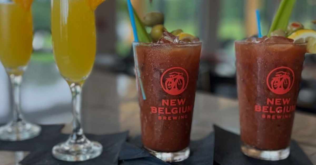 bloody marys in cups on top of napkins