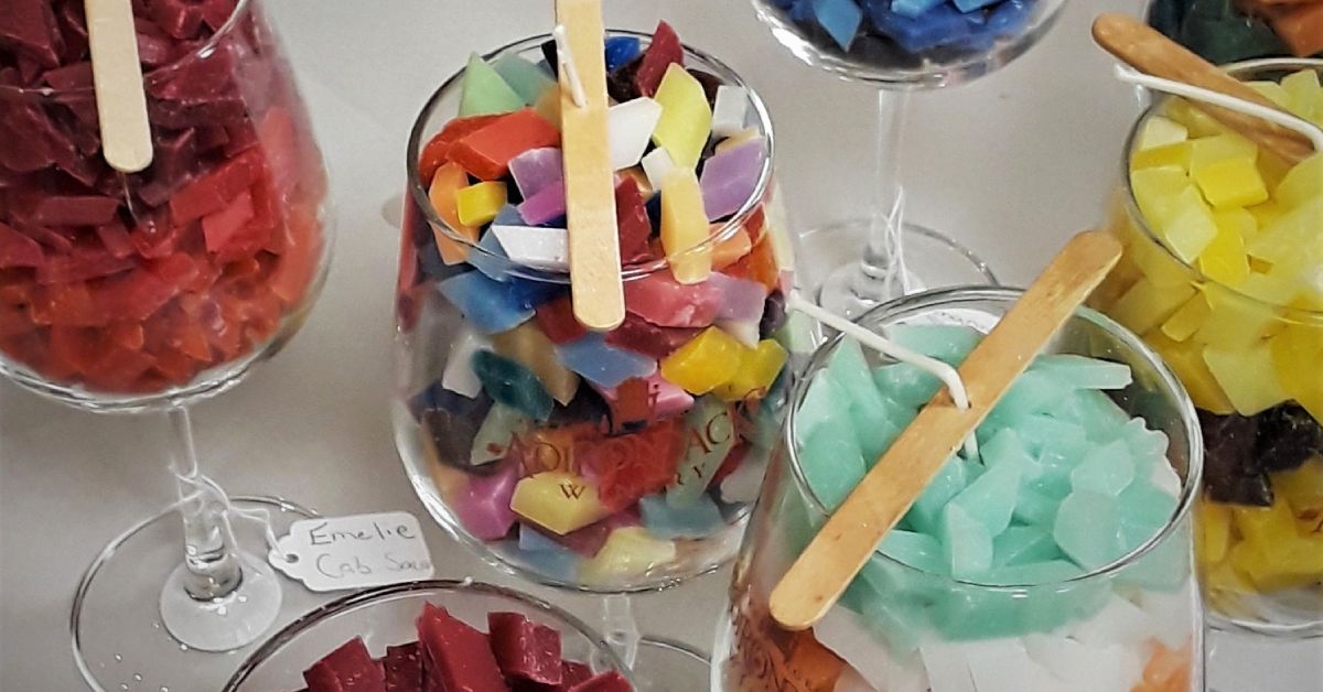 candles being made in wine glasses