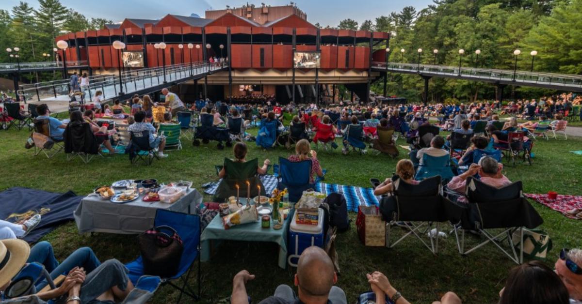 Audience gathered on the lawn at SPAC during an outdoor summer performance in Saratoga Springs.