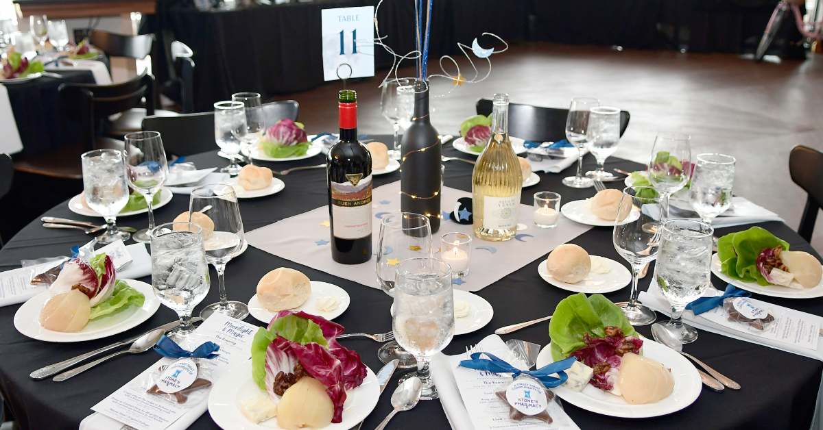 a circular table with the number 11 card and plates of food