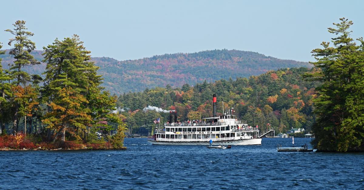 The Minne Ha Ha steamboat on Lake George traveling between islands in the fall