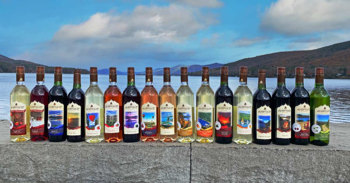 lineup of Adirondack Winery wines by the lake