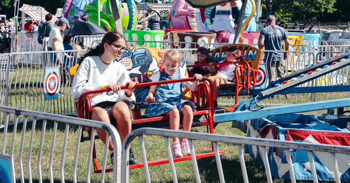 kids riding on a spinning amusement ride