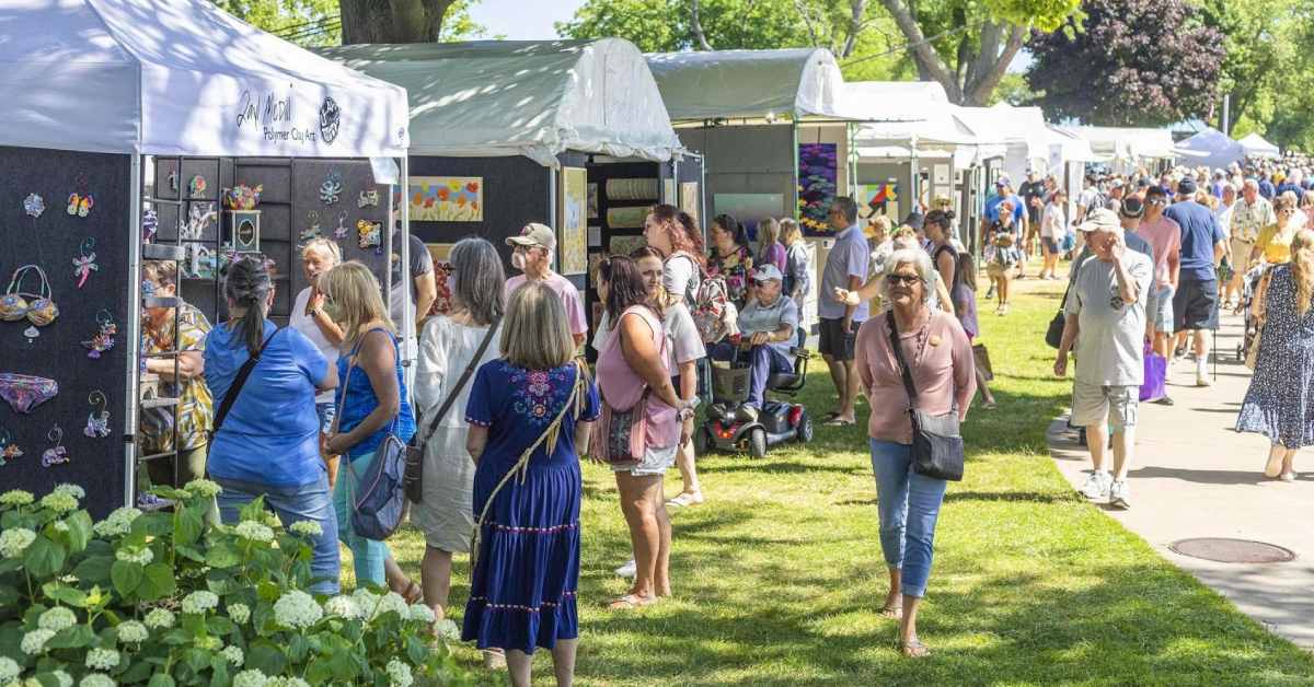 people walking around an art vendor market