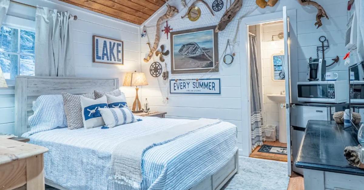 a cabin bedroom with beach themed decor