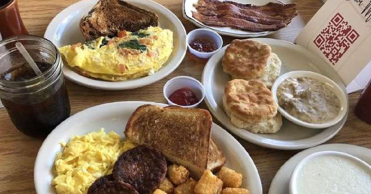 Fresh breakfast dishes on a table with coffee