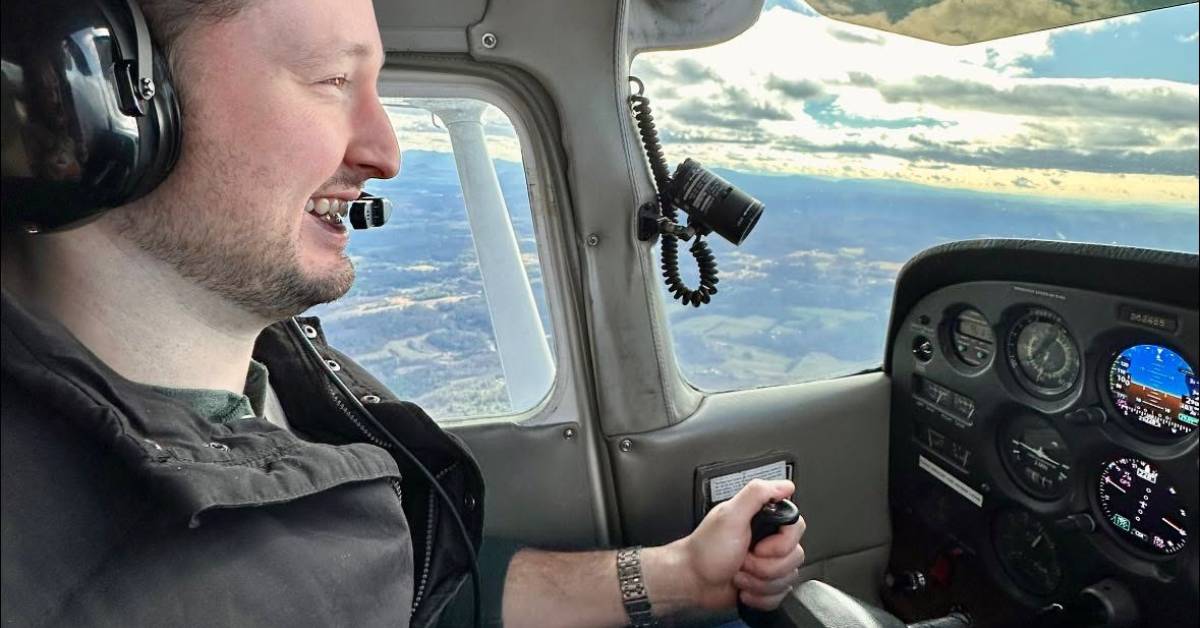 man flying airplane