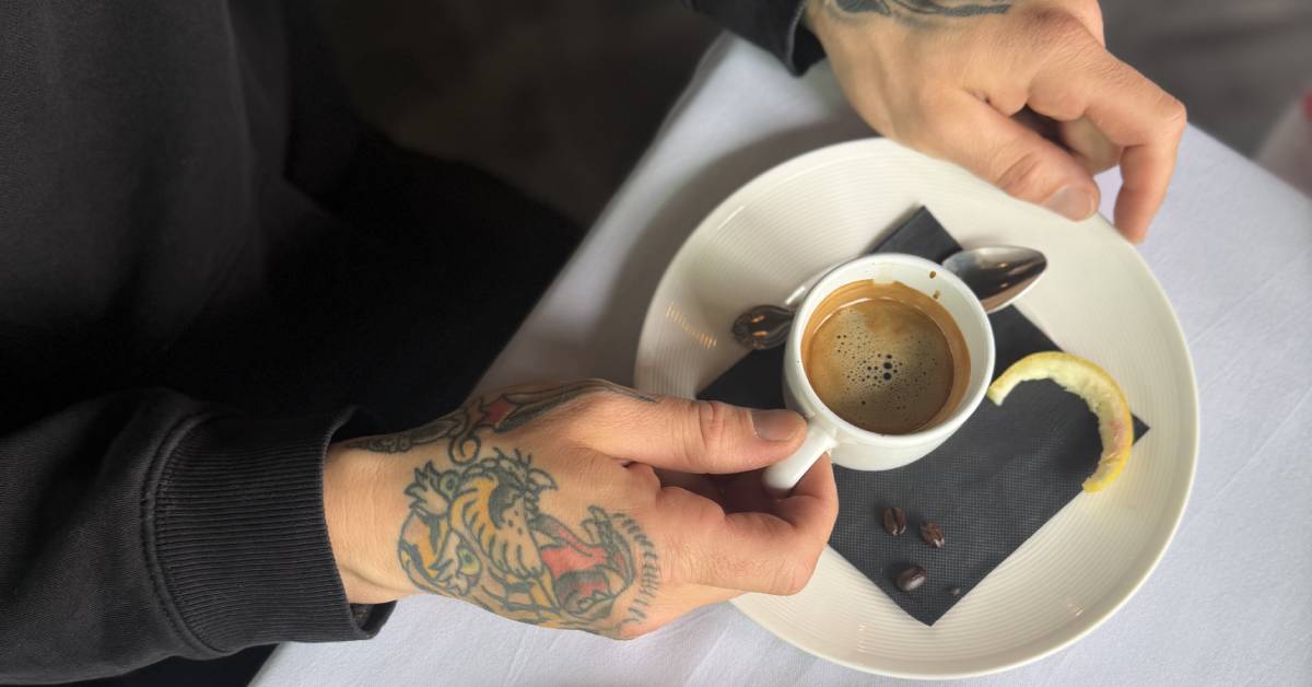 hands holding coffee