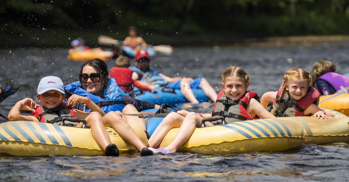 people lazy river tubing