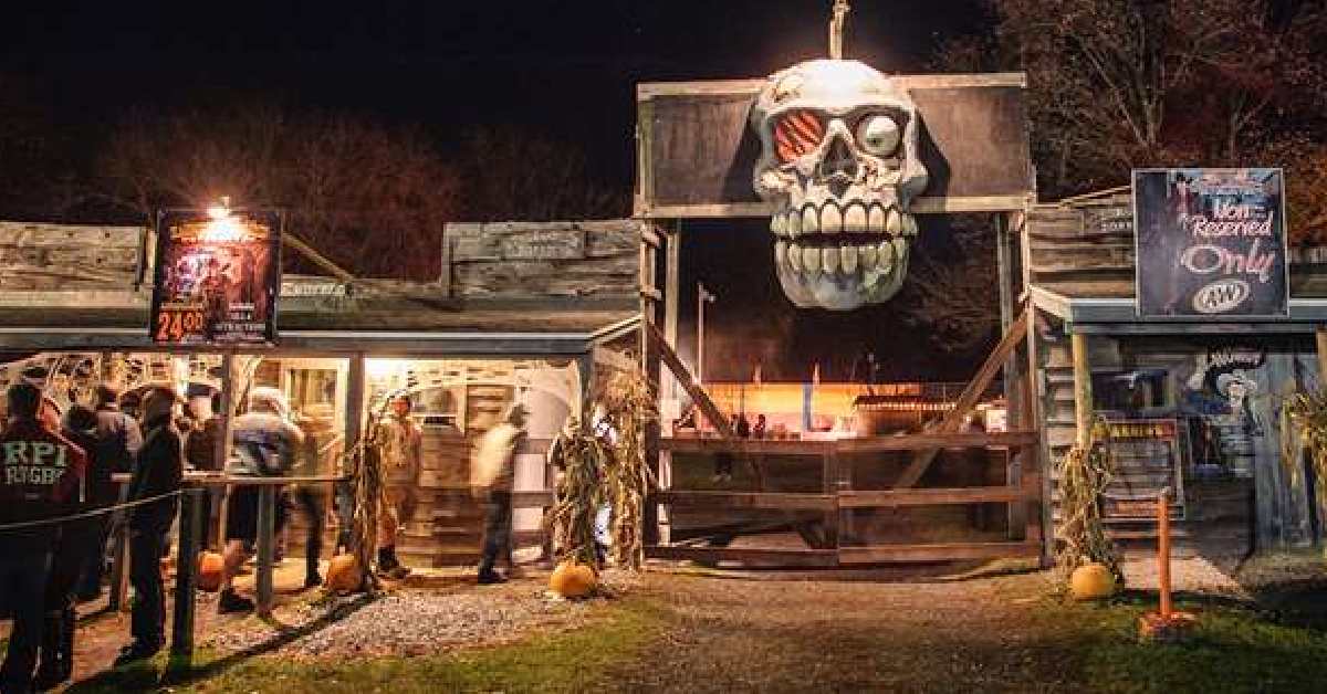 people in line to purchase tickets for haunted hayride