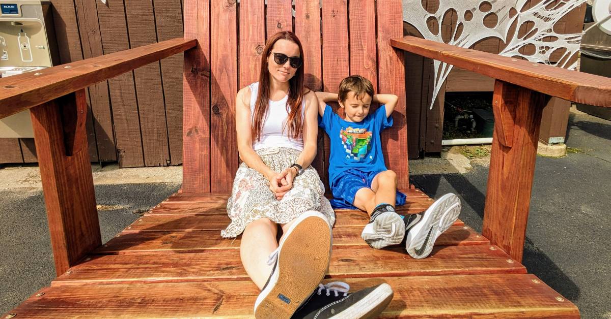 mom and son in giant adirondack chair