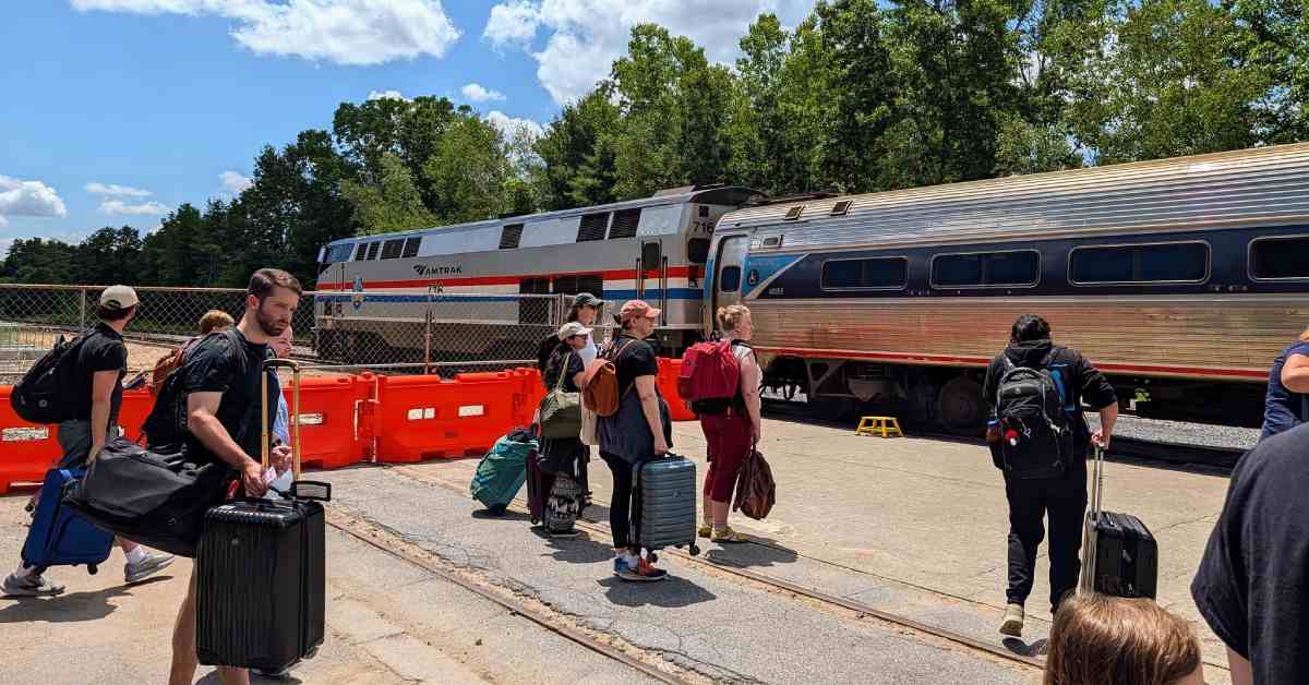 people waiting to board amtrak