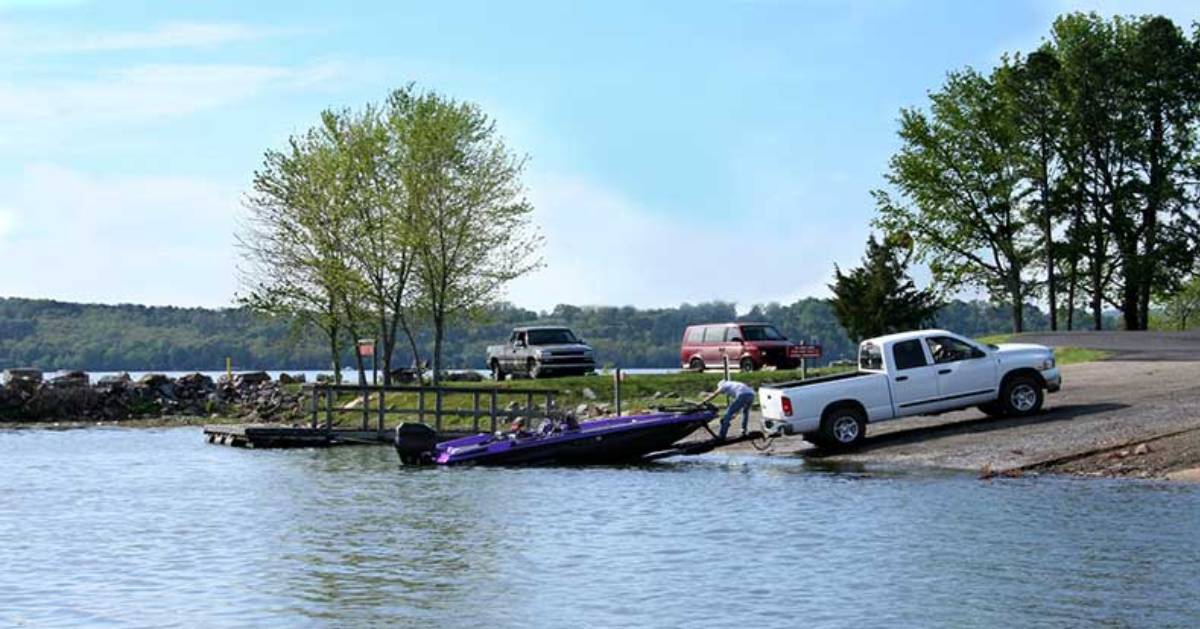 a white truck and a boat trailer