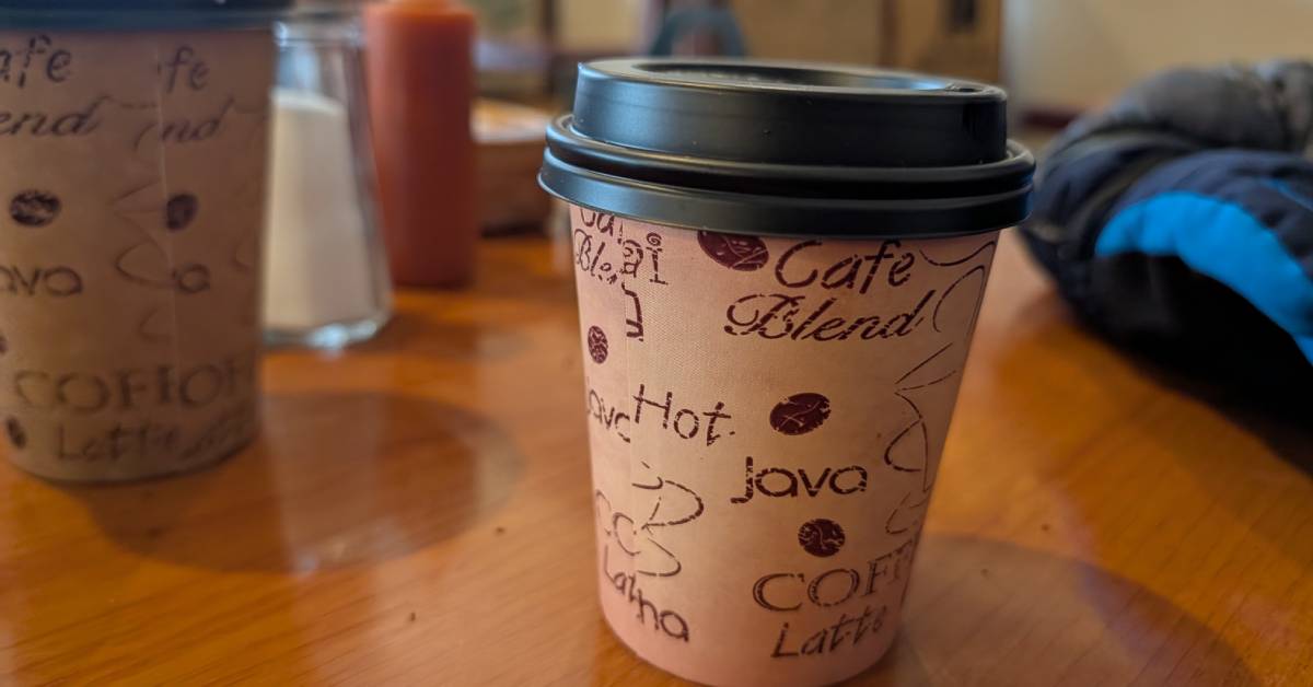 to-go coffee cups on table