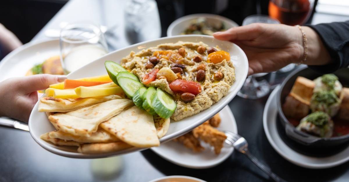 plate being passed with quesadillas