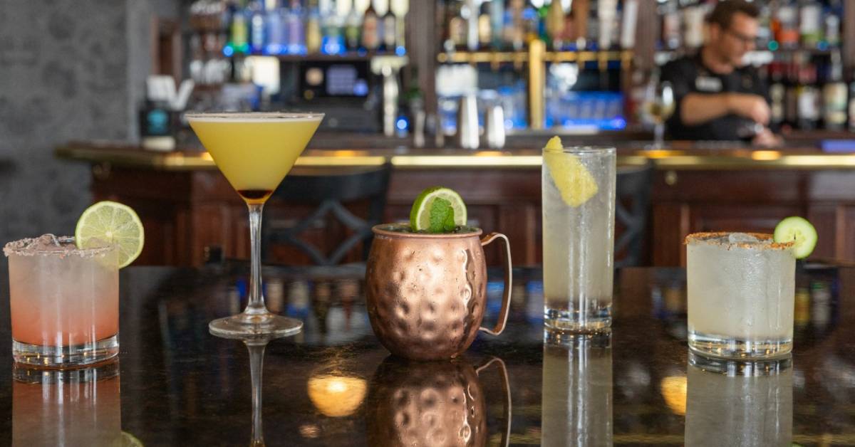 craft cocktails lined up on bar