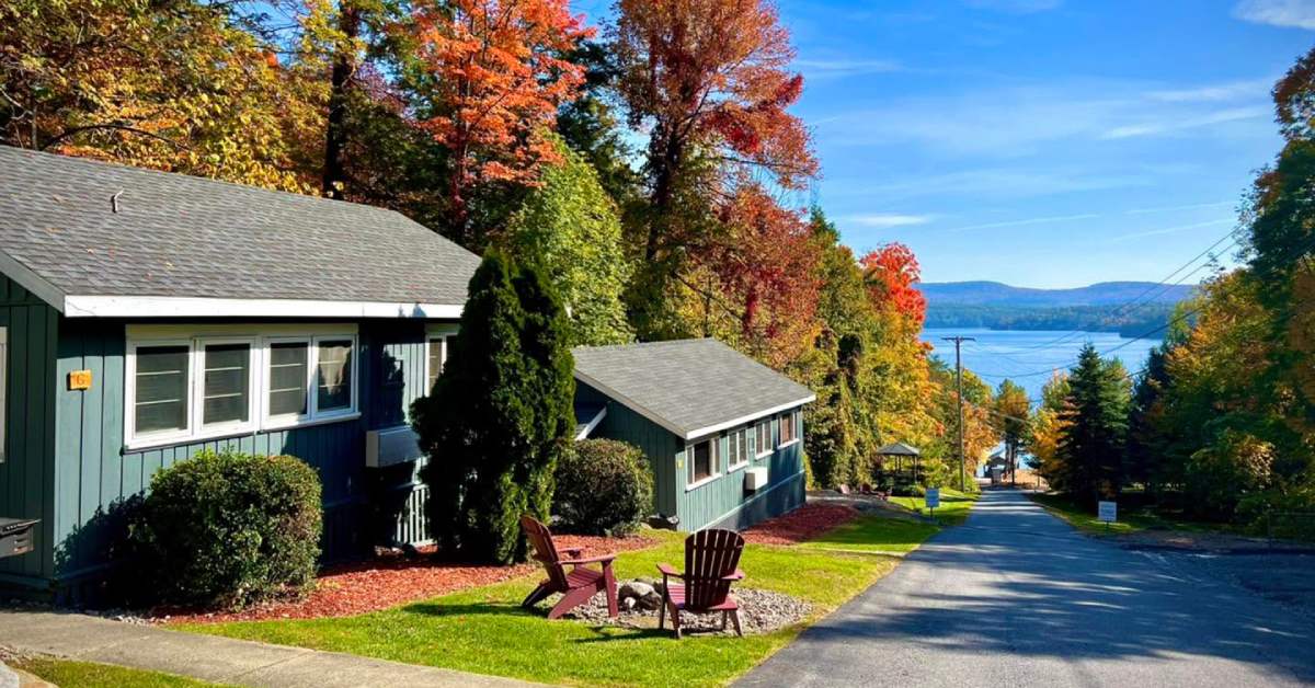 cabins along a walkway leading to a beach