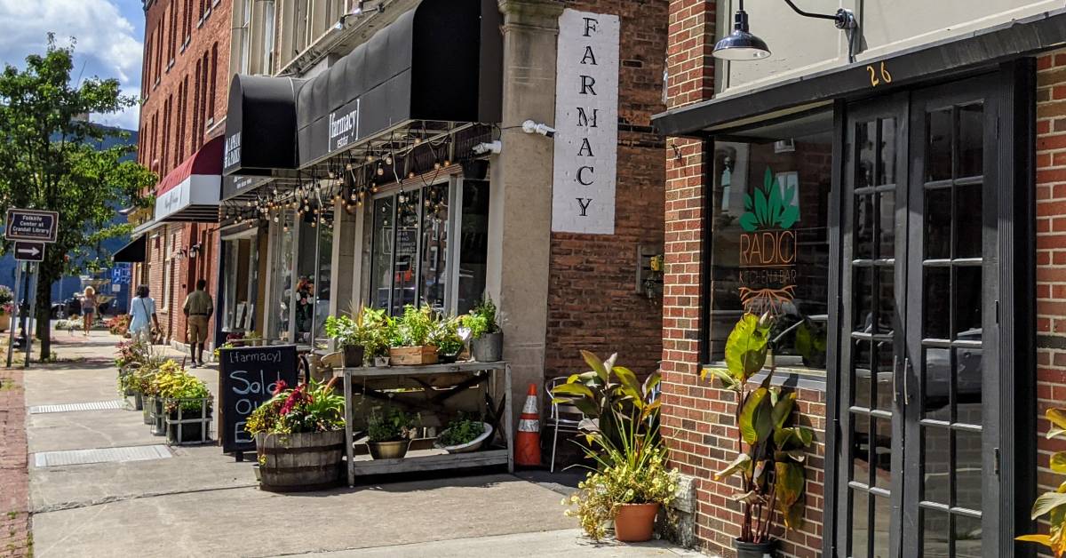 glens falls street with farmacy and radici