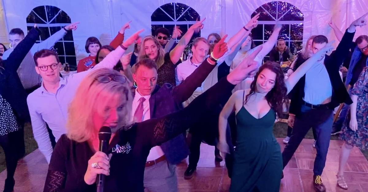 people line dancing at a wedding