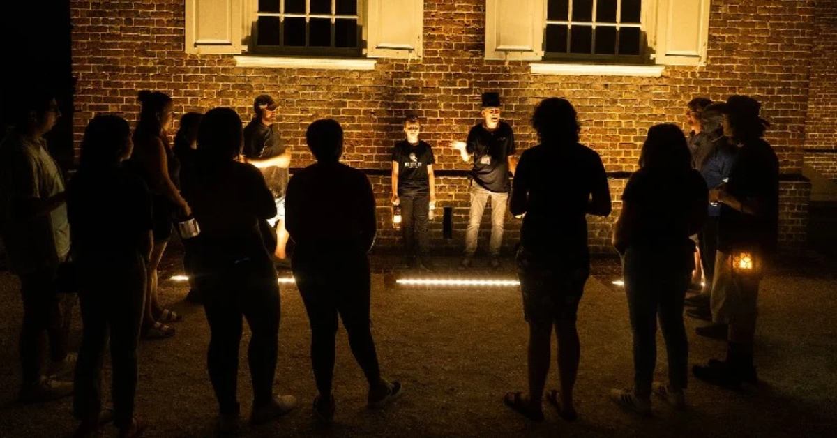group of people standing around each other