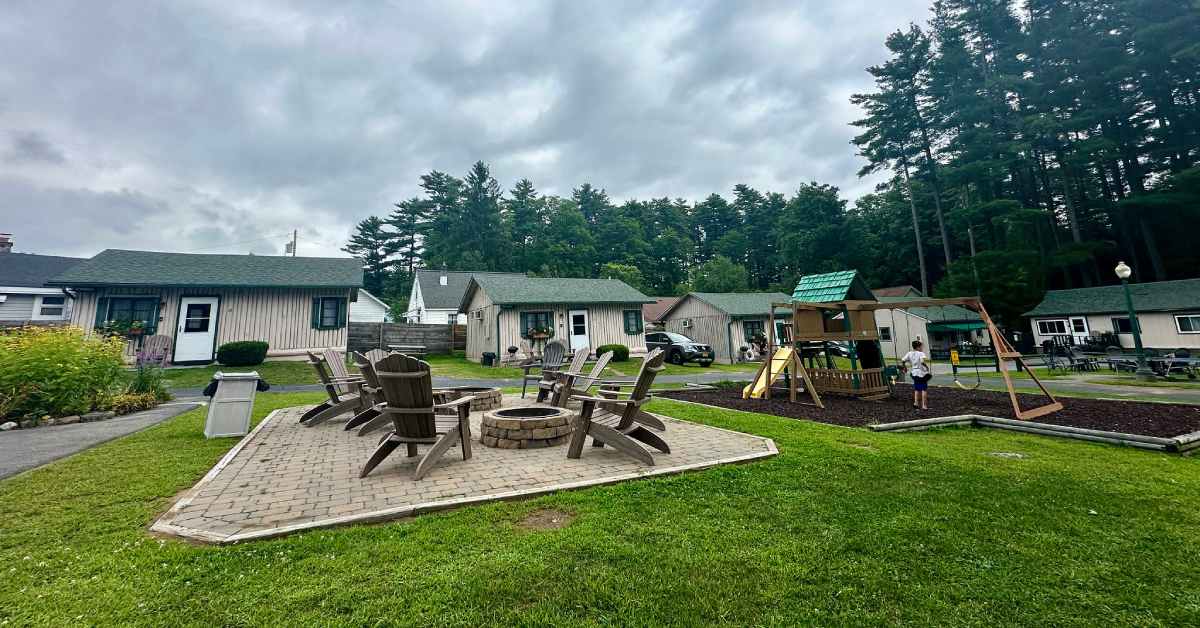 fire pits and playground surrounded by cabins
