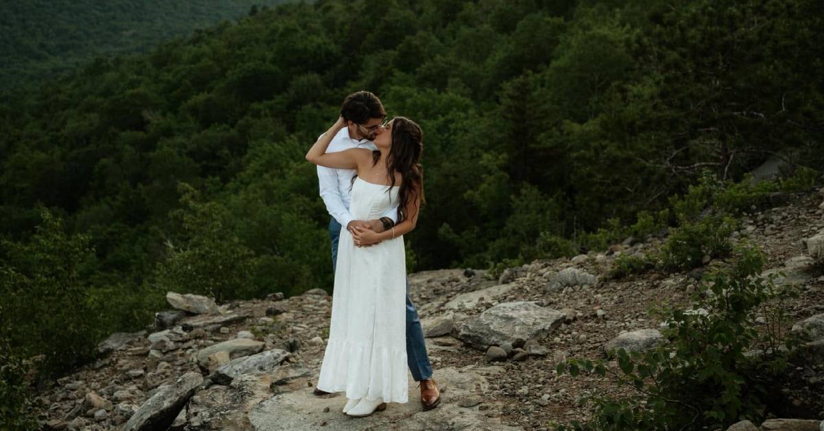 bride and groom on mountaintop