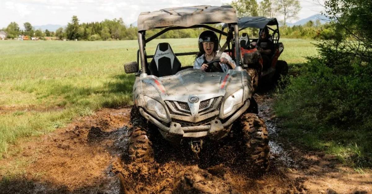 people in RVs go through mud