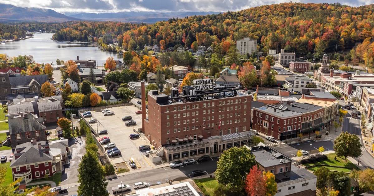 aerial view of hotel saranac surrounded by fall foliage