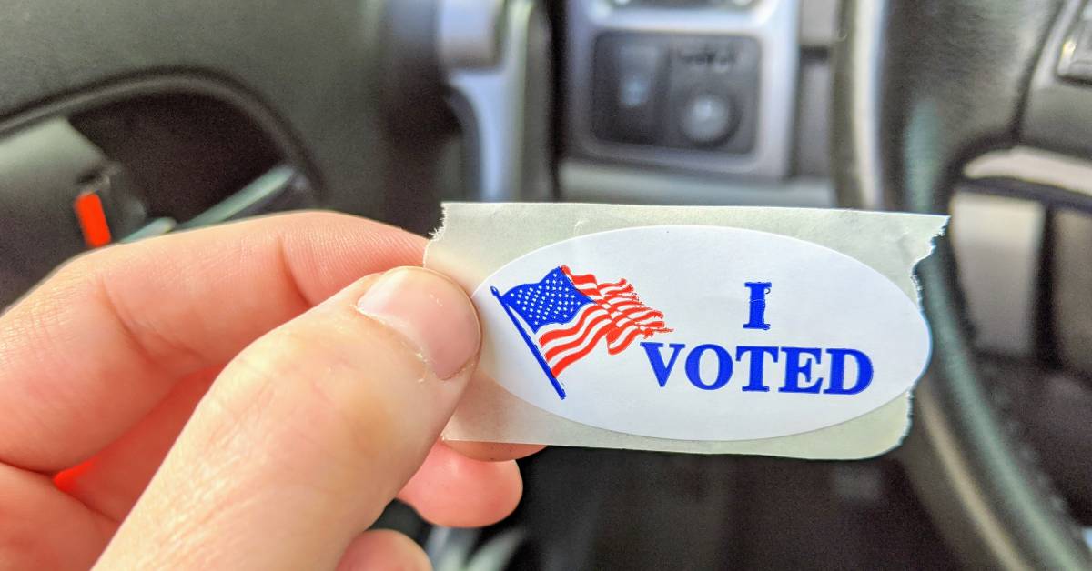 hand holding up i voted sticker