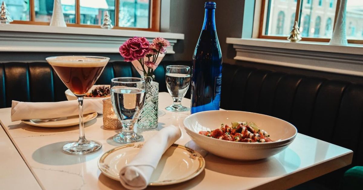 plates and food and drinks at a table at mint