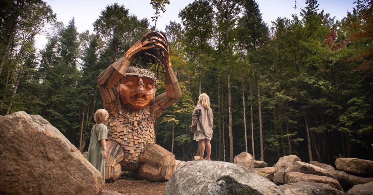 Patrick Sapling troll sculpture surrounded by Adirondack forest at The Wild Center in Tupper Lake.