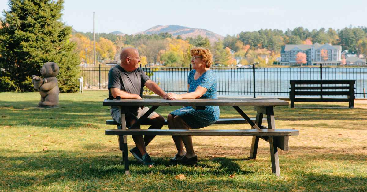 couple sitting at picnic table