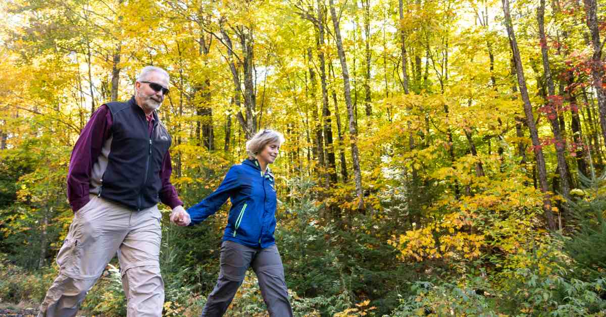 couple walking in woods