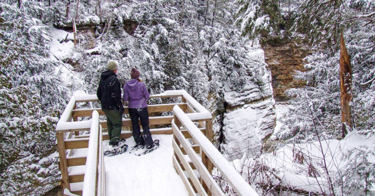 couple on showshoes in winter at ausable chasm