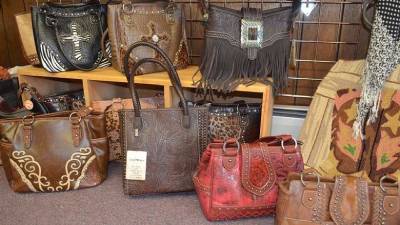a collection of western purses